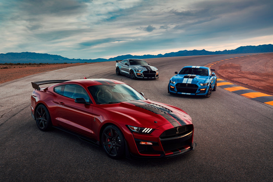 Three ford mustangs
