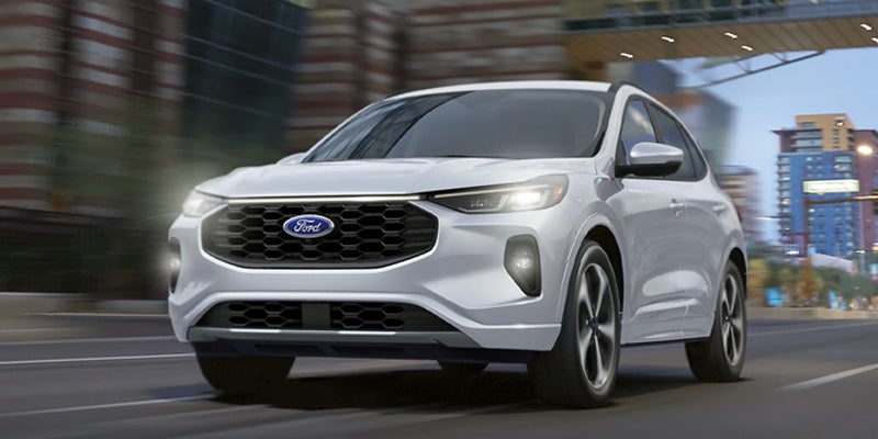 Front-angled view of 2025 Ford Escape driving through the city