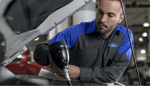 Ford Technician performing vehicle repairs 